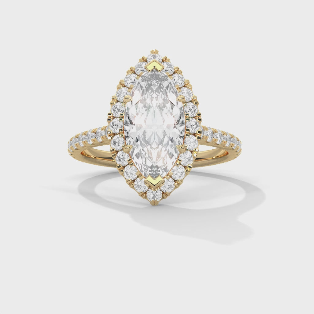 Gold ring with a large central diamond and smaller diamonds around on a white background 