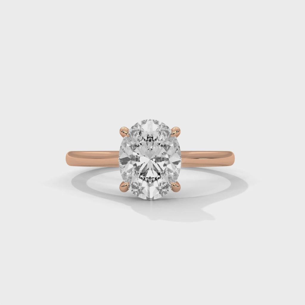 Rose gold ring with a large diamond on a white background #rose-gold