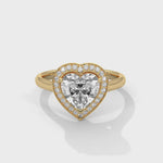Gold ring with a diamond on a white background 