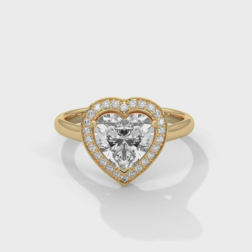 Gold ring with a diamond on a white background 