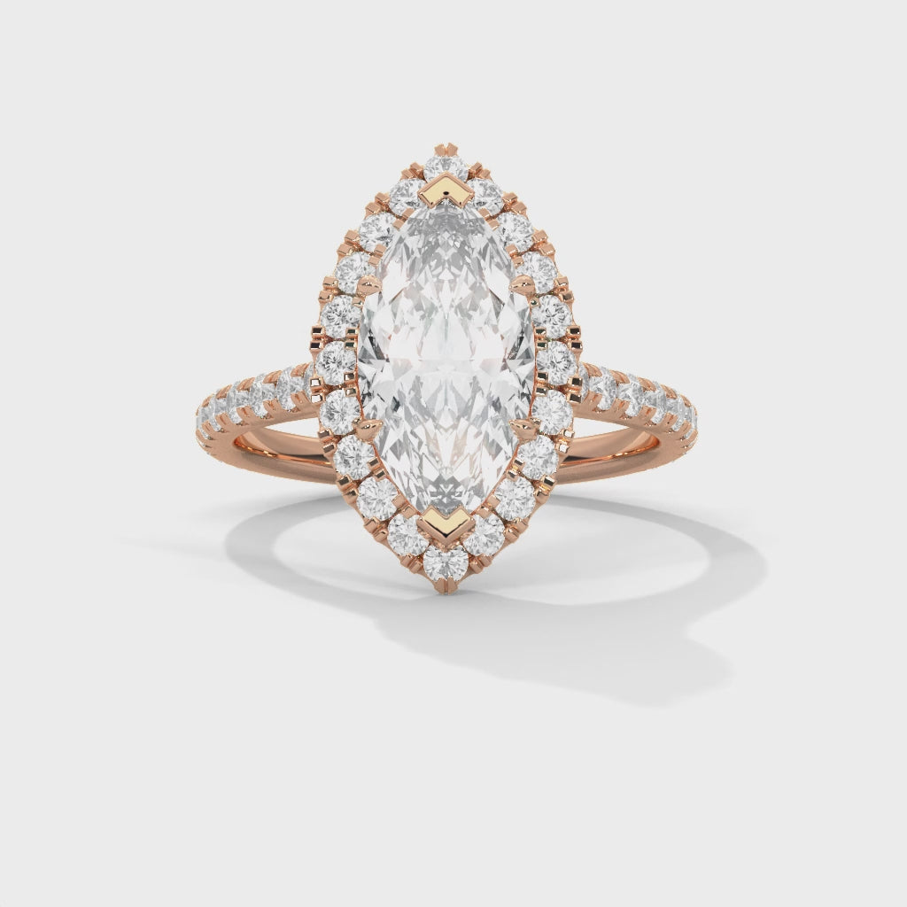 Rose gold ring with a large diamond and smaller diamonds on a white background #rose-gold